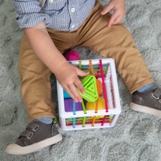 Fat Brain Inny Bin with child