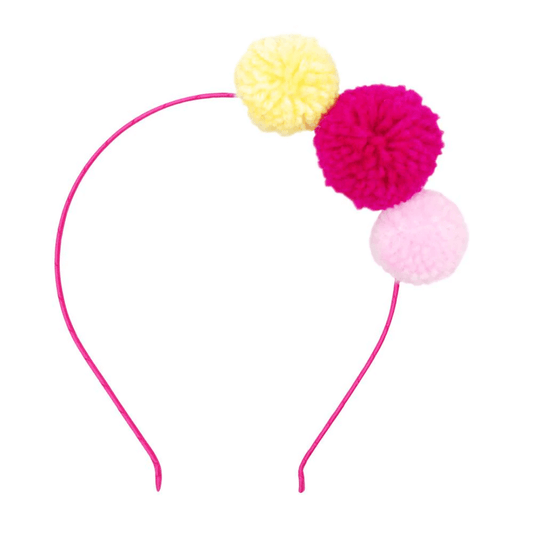 Headband with pink and yellow pom poms
