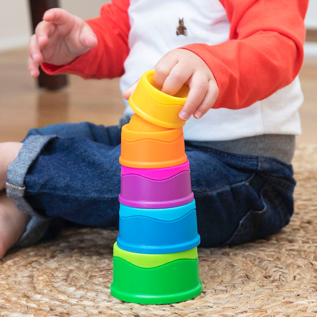 Child plays with stacked Fat Brain Toys Dimpl Stack